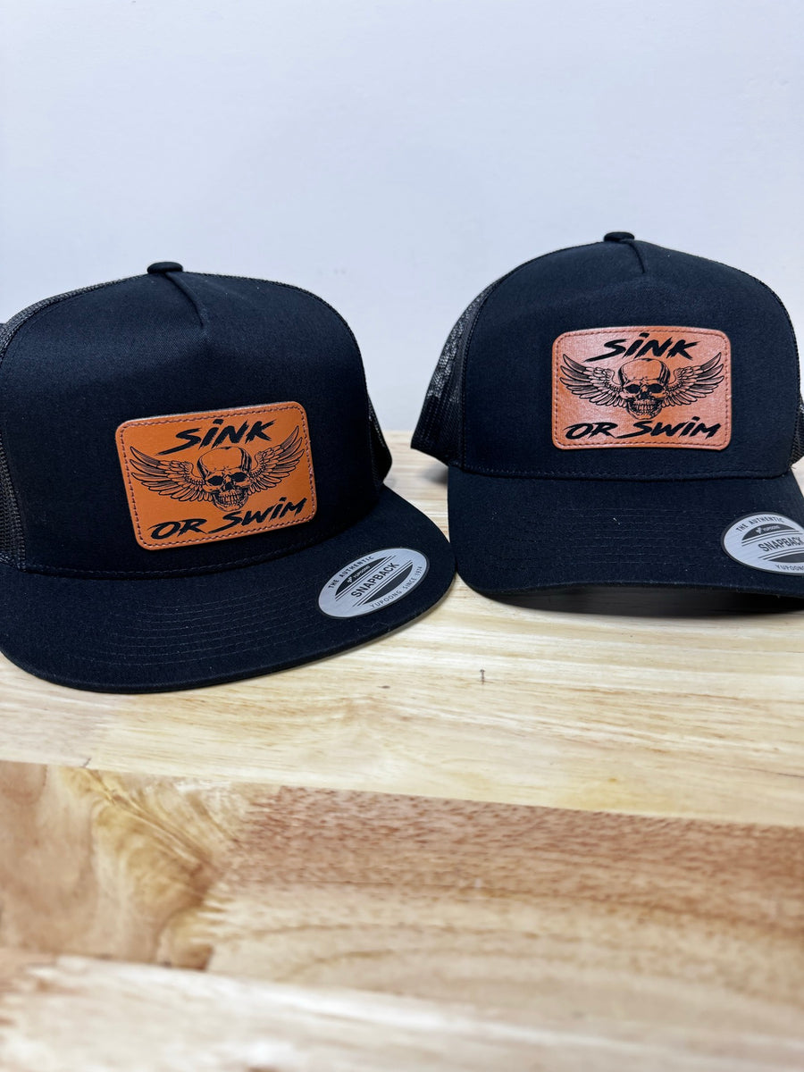 Black custom hats with engraved Sink or Swim patches
