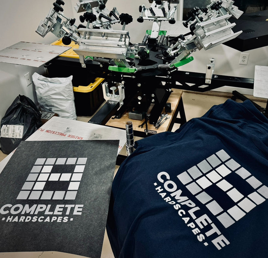 Complete Hardscapes white screen print on navy hoodie